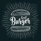 Best burger lettering with rays and vintage illustration bun.