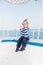 Best cruises for kids. Kid boy toddler travelling sea cruise. Child in striped shirt looks like young sailor. Child