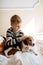 Best Dog Breeds for Kids, Good Family Dogs. Introducing Puppies and Children. Cute little Beagle puppy and kid boy