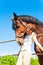 Best friend`s hug. redhead girl with favorite horse.