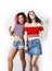 Best friends diverse races teenage girls together having fun, asian and african , posing emotional on white background