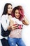 Best friends diverse races teenage girls together having fun, asian and african , posing emotional on white background