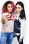 Best friends diverse races teenage girls together having fun, asian and african , posing emotional on white background