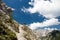 Best friends hiking on a gorgeous Alpine slope on a sunny summer day