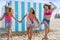 Best friends teen girls running happy in beach