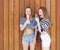 The best lifestyle portrait of two best friends girls wearing stylish bright marine outfits, denim shorts. Girl screaming in the