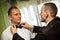 Best man dressing groom