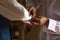 Best man helping groom with cufflinks