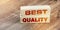 Best Quality words on wooden blocks. High quality evaluation Business concept