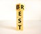 Best rest symbol. Turned wooden cubes and changed the word Rest to Best. Beautiful white table white background. Business and best