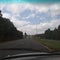 Best road perspective  view,  trees  on sides, white clouds