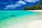 The best swimming beach with palm trees on tropical Cook Islands