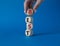 Best symbol. Concept word Best on wooden cubes. Businessman hand. Beautiful blue background. Business and Best concept. Copy space