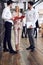 Best team ever. Group of young multi ethnic business people in formal wear working together and smiling while standing in the