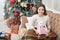 Best time of the year. Adorable girl play with toy in christmas eve. Cozy concept. Smiling child enjoy winter holidays