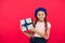 Best toys and christmas gifts. Kid little girl in beret hat hold gift box. Child excited about unpacking gift. Small