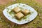 the best turkish special baklava Together with pistachios on a plate