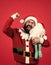 Best wishes. seasonal xmas sales. bearded mature man wear red santa claus costume with toy. ready for celebration