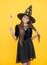 Best witch. smiling child in hat. kid hold magic wand. witchcraft and enchantment. childhood autumn holiday. teen girl