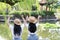 Bestie lovely beauty Asia Chinese high school girl student smile enjoy free time in a park best friend love gesture letter