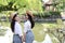 Bestie lovely beauty Asia Chinese high school girl student smile enjoy free time in a park best friend love gesture letter