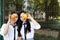 Bestie Lovely beauty Asia Chinese high school girl student smile enjoy free time on playground best friend fruit orange