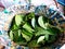 Betel leaves are in an old plastic basket.