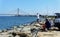 Bethany Beach, Delaware, U.S.A - September 2, 2019 - People fishing for flounder on the rocks by Indian River Inlet