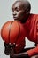 Better be ready for what shes about to bring. Studio shot of an attractive young woman playing basketball against a grey