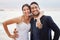 For better or worse, in sickness and health, for richer or poorer. Shot of a young couple on the beach on their wedding