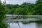 Beuatiful landscape of trees, lush foliage and their reflection  in the waters of Waterloo Lake in Roundhay Park, Leeds, UK