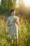 Beuatiful young woman holding wildflowers