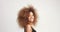 Beuayt black woman with a huge afro hair having fun smiling and touching her hair