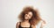 Beuayt black woman with a huge afro hair having fun smiling and touching her hair