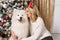 Beutiful blonde girl posing with white dog