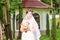 Beutiful bride in white dress holding wedding