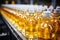 Beverage production line filling glass bottles with refreshing apple and pineapple juice