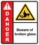Beware of broken glass. Glass shards dump area. Sign Danger