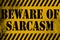 Beware of sarcasm sign yellow with stripes