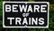 Beware of trains sign.