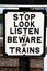 Beware of trains sign.