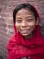 BHAKTAPUR, NEPAL-OCT 14 , 2012 : the unidentified girl is greeting people with her welcome and naive smile at durbar square. .