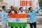 Bhopal city inscription. Group of four indian male friends with India flag making selfie on mobile phone. Largest India cities