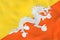 Bhutan waving flag. Bhutan national flag background texture