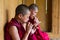 Bhutanese Buddhist novice monks playing flute , Bhutan