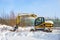 Bialystok, Poland, 24.01.2021 - Single yellow JCB Smiths Digger stationary in winter snow with nobody present waits to start work