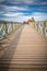 Biarritz, France - October 4, 2017: tourists people walking on wooden bridge pathway to wonderful place of rocher de la vierge in