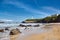 Biarritz, France. Sand beach Miramar Plage overlooking the white lighthouse - Phare de Biarritz on the Pointe Saint-Martin