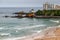 Biarritz, France. View of the beach with surfers, coastline and iconic landmarks.