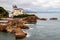 Biarritz, France. View of the rocky coastline with iconic landmark Villa Belza built in 19th century.